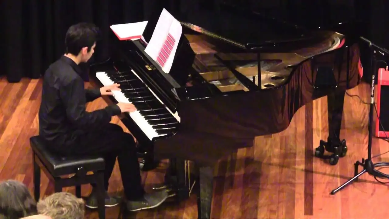 Nick playing piano at a concert